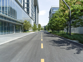 enpty asphalt road with modern office building