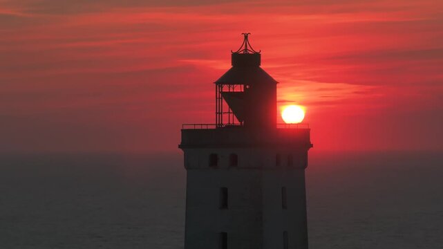 Aerial view of the giant sand dunes with the famous lighthouse on the top of a hill. Rubjerg Knude Lighthouse, , North SeaRubjerg , Sunset at the lighthouse Rubjerg Knude Fyr near Lokken in Denmark. 