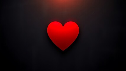 Vibrant red heart shape against dark textured background, conveying minimalist emotional concept.