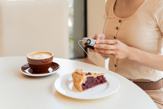 Diabetic woman using insulin pump before meal