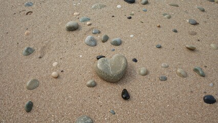 Shoreline Adorned with River Stones and a Heart-Like Pebble