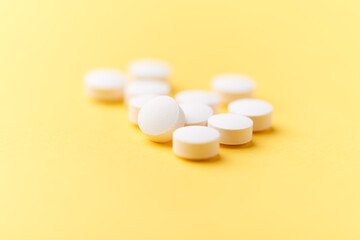 Amino acids capsules on bright background. Soft focus. Close up. Copy space.	