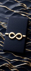 Elegant Dark Blue Wallet with Gold Infinity Closure on Wavy Background