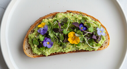 Overhead Vegan Avocado Toast with Microgreens and Edible Flowers