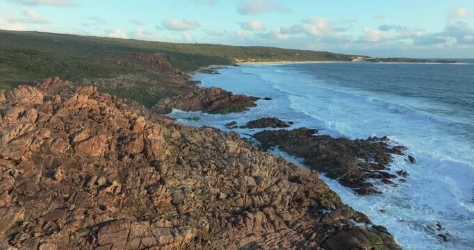 4k Aerial views of rugged rocky coastline in South West Australia at sunset
