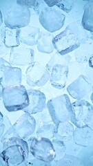Ice Cubes. Textured Ice on a Blue Background, Close-up. Abstract Background, Flying Ice. Vertical Aspect Ratio.