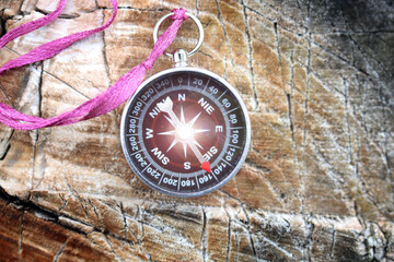 Classic navigation shiny compass on natural background