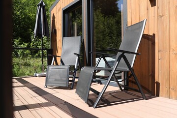 Cottage terrace with chairs on sunny day