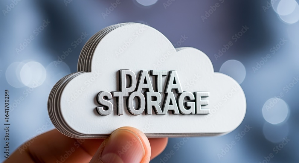 Poster cloud data storage concept: hand holding a cloud symbol with text against bokeh background