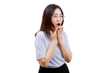 Asian young beautiful woman expresses surprise with her mouth open and hands on her face, wearing glasses and a casual outfit.