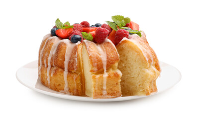 Delicious bundt cake with berries, glaze and mint isolated on white