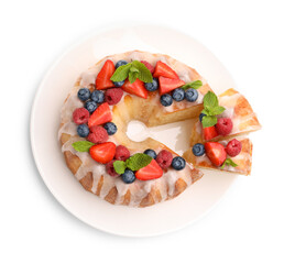 Delicious bundt cake with berries, glaze and mint isolated on white, top view