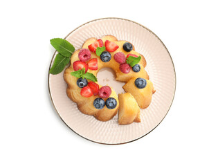 Tasty Bundt cake with berries and mint isolated on white, top view