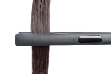 Straightener with brown hair lock isolated on white