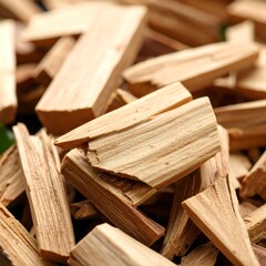Close-up of light brown wood pieces, irregularly shaped and piled together