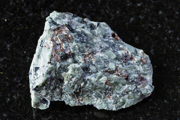 nepheline with sphene, feldspar mineral on black