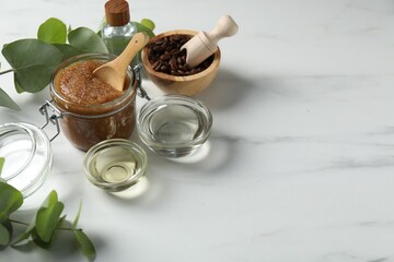 Natural body scrub and ingredients on white table. Space for text