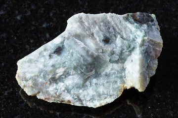 sample of raw trass chernomorite mineral on black