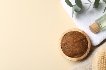 Natural body scrub and ingredients on beige table, flat lay. Space for text