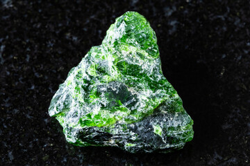 sample of raw chrome diopside mineral on black