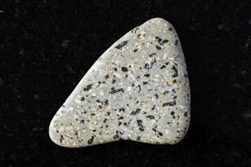 sample of polished andesite mineral on black