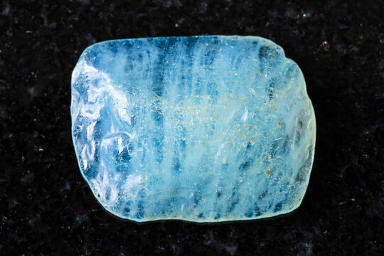 sample of tumbled aquamarine mineral on black