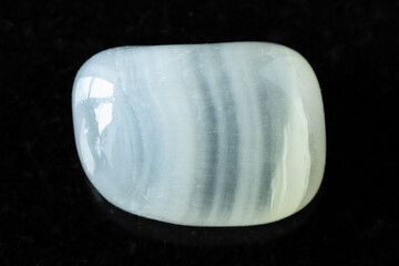 polished colorless calcite mineral on black