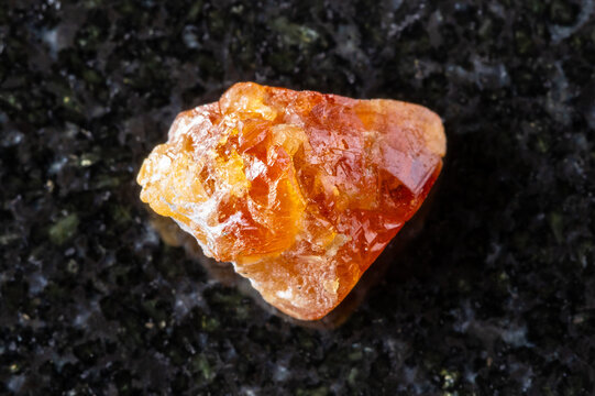 sample of unpolished scheelite mineral on black