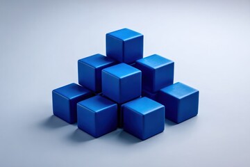 Stacked blue cubes on a light gray surface