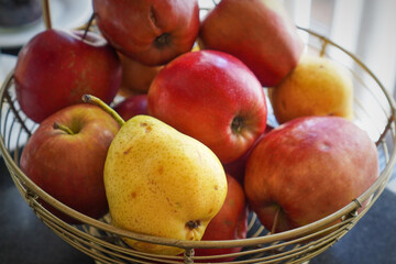 Bowl of fresh red apples piled together as a healthy snack or decorative display