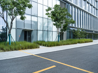 enpty asphalt road with modern office building