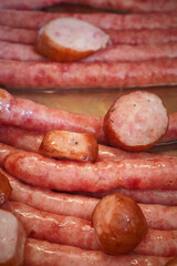 Stacked cooked sausages ready for serving on a buffet or platter
