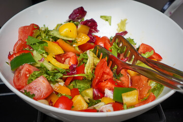 Fresh salad bowl with vibrant vegetables and mixed greens