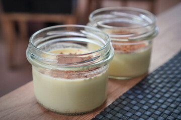 Two dessert jars showcased on a placemat ready for serving