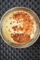 Individual caramelized custard in a small ramekin with golden top