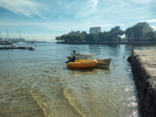 Fototapeta premium Urca neighborhood, city, vacation, life, fun, beautiful nature, sea, ocean, beach, sand, wave, water, blue sky, landscape, background, boat, dinghy, kayak, sailboat, ship, anchorage, deck, bay, parkin