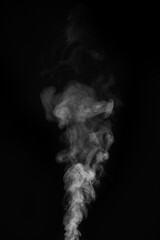 White smoke swirling upwards in dark atmosphere captured in monochrome style. Swirling, writhing smoke to overlay on your photos. Steam explosion special effect. Halloween design