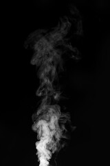 White smoke swirling upwards in dark atmosphere captured in monochrome style. Swirling, writhing smoke to overlay on your photos. Steam explosion special effect. Halloween design.