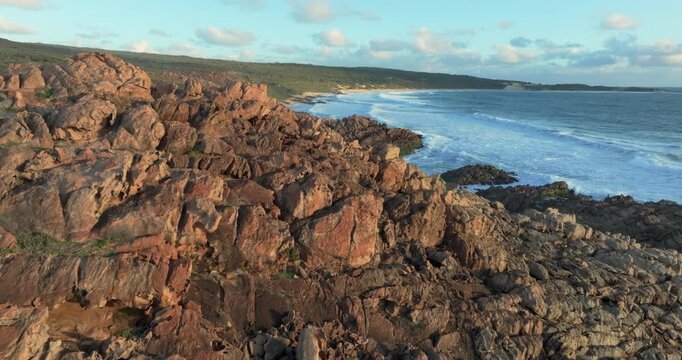 4k Aerial views of rugged rocky coastline in South West Australia at sunset