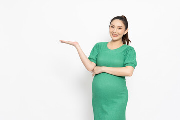 Happy Asian Pregnant woman standing smile and present to copy space isolated on white background,...