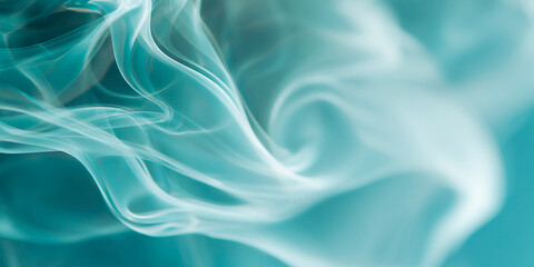 Obraz premium Abstract flowing smoke in soft blue tones creating delicate swirling shapes and a dreamy ethereal texture 