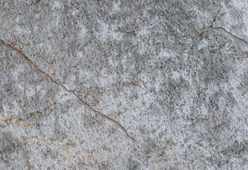 Natural stone texture background with cracks and weathered surface