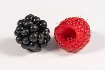 Juicy Blackberries and Raspberries Side by Side in Bright Setting