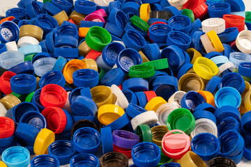 Collection of Colorful Plastic Bottle Caps at a Recycling Center