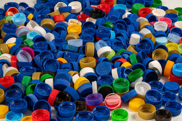 Colorful Collection of Bottle Caps Scattered Across a Surface
