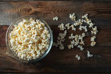 Pop corn on wood color background.Food and snack concepts ideas.Minimal style top view mockup