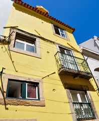 typical yellow house in the historic center of Lisbon portugal