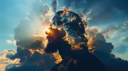 Man silhouette filled with warm sunset clouds. Overlay on person shape. Religious concept. Christ figure, resurrection art.