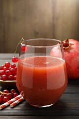 Superfood. Tasty smoothie in glass and ingredients on wooden table, closeup