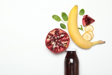 Superfood. Tasty smoothie in glass bottle and ingredients on white background, top view. Space for...